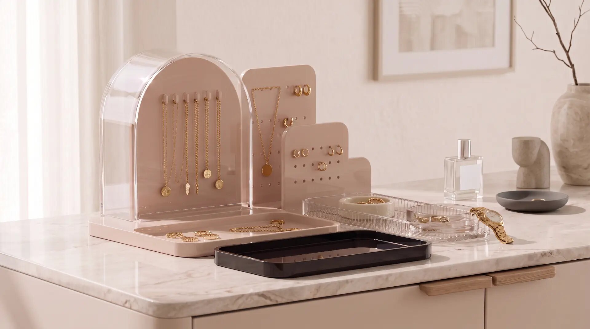 The Bloom collection styled with gold jewellery on a marble dresser